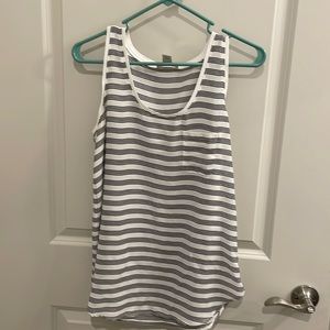 Loft size small flowy tank top stripped. With a picket on left breast. Worn 1